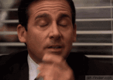 a close up of a man 's face with his eyes closed a close up of a man 's face with his eyes closed