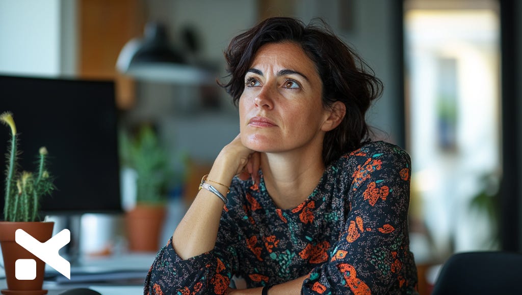 woman-executive-pondering-in-her-office-the-executive-designer-blog