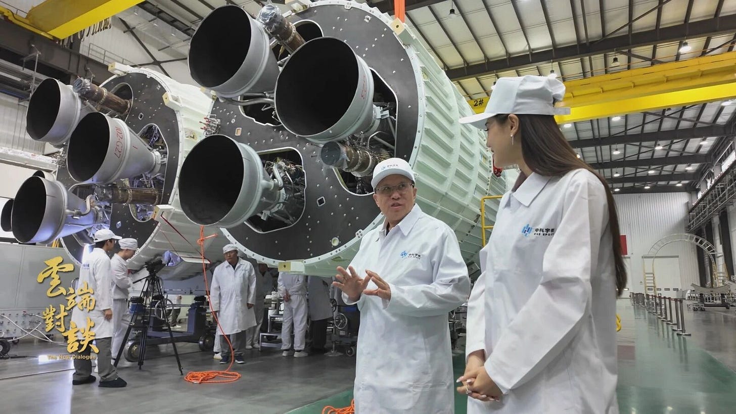 Yang Yiqiang (center) with two of the three first-stage booster cores being prepared for Kinetica-2’s debut flight. Yang Yiqiang (center) with two of the three first-stage booster cores being prepared for Kinetica-2’s debut flight.