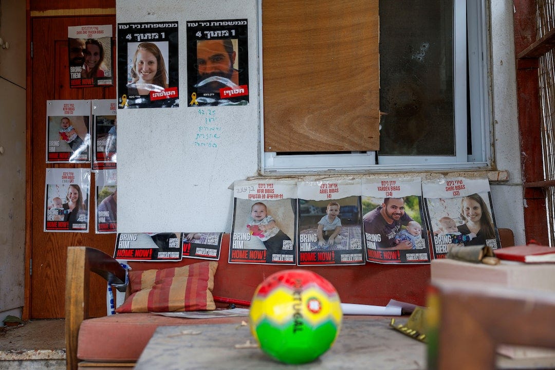 Posters of the Bibas family are displayed at their house, following the deadly October 7, 2023 attack by Hamas, in Kibbutz Nir Oz