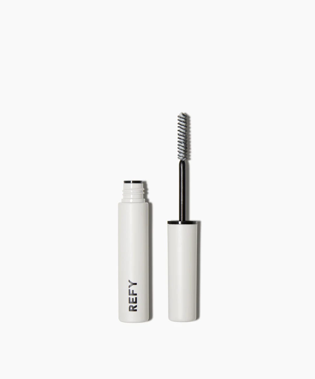 The double-ended REFY Clear Brow Sculpt applicator, showing the sculpting brush and the clear brow gel formula used for a natural, laminated look. The double-ended REFY Clear Brow Sculpt applicator, showing the sculpting brush and the clear brow gel formula used for a natural, laminated look.