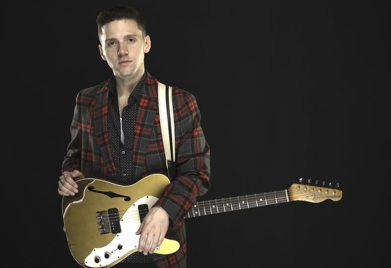 May be an image of guitar