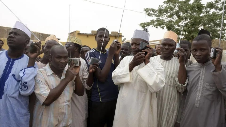 Men listening to radio Men listening to radio