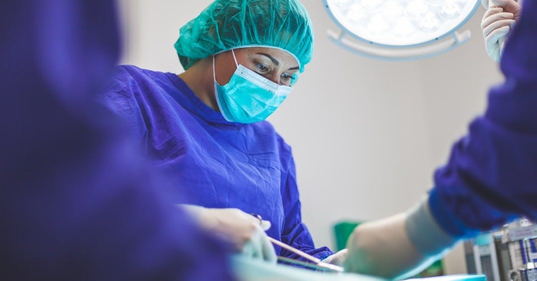 woman wears green face mask woman wears green face mask