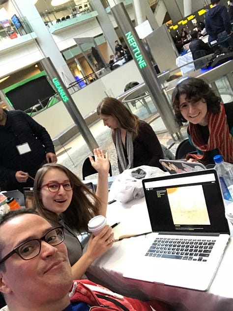 Photographs from a software engineer's overnight sleepover during a hackathon. It includes images of the museum empty at night, the team working together and a photo of earth projected on a screen.