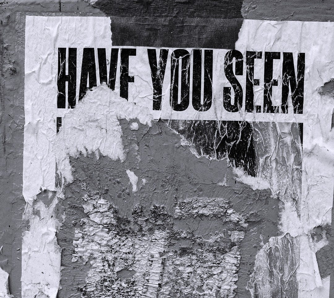 Missing person poster, torn and weathered. Missing person poster, torn and weathered.