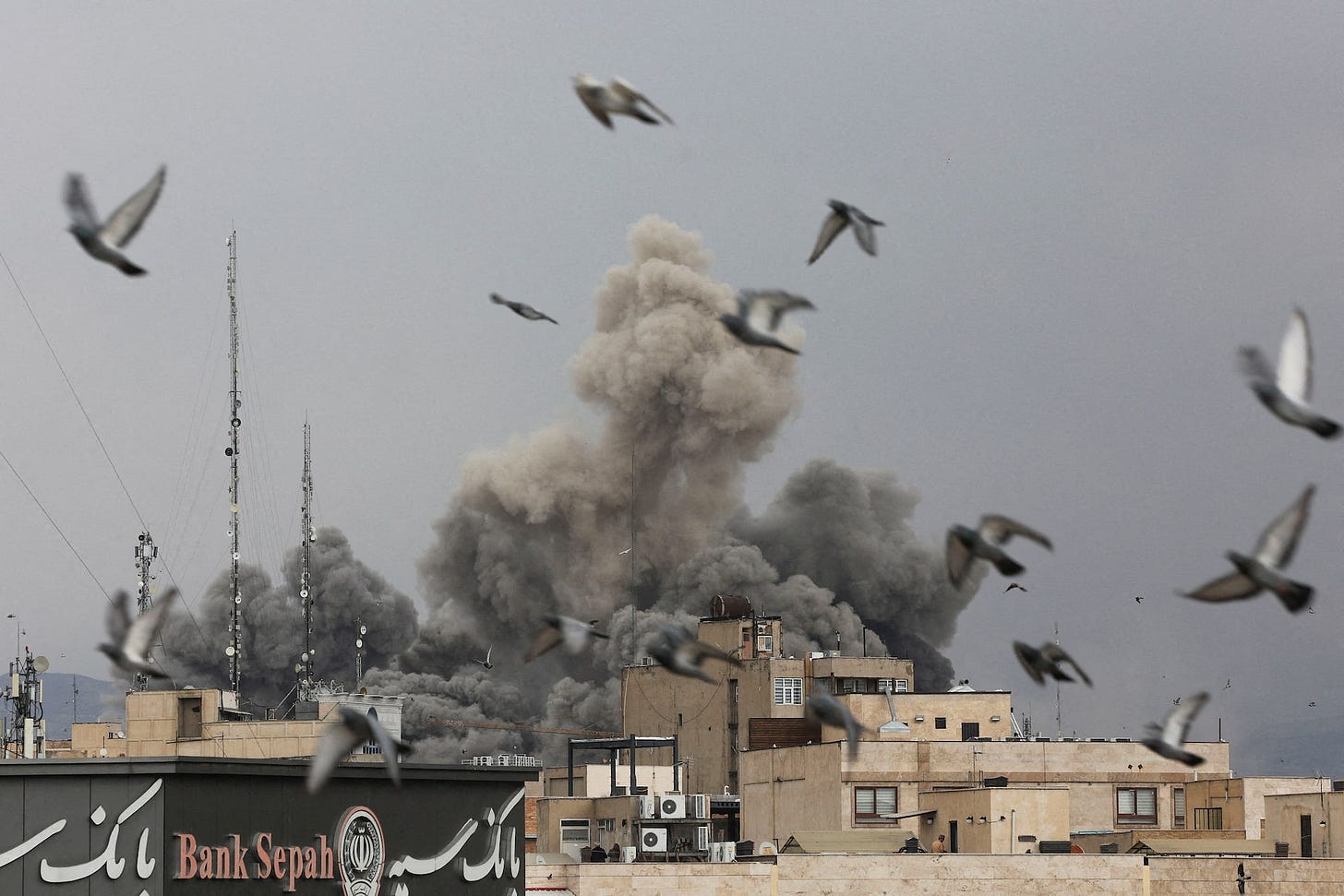 Smoke rises following an explosion, after Israel and the U.S. launched strikes on Iran, in Tehran