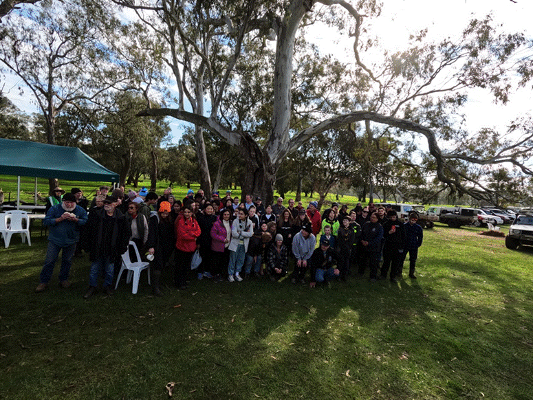 Title: Volunteers gathered beneath a grand old gum at Glenaroua Station - Description: Volunteers gathered beneath a grand old gum at Glenaroua Station
