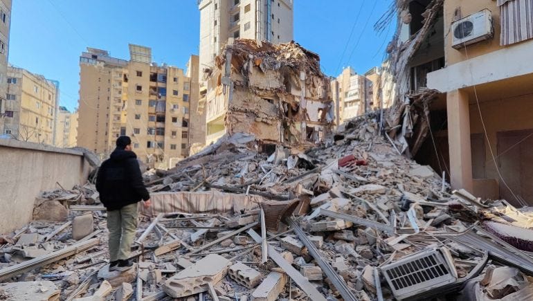 A person stands on the rubble of a damaged building after an Israeli strike on Beirut's southern suburbs, following renewed hostilities between Hezbollah and Israel amid the U.S.-Israeli conflict with Iran, Lebanon, March 5, 2026. Picture taken with a mobile phone. REUTERS/Stringer A person stands on the rubble of a damaged building after an Israeli strike on Beirut's southern suburbs, following renewed hostilities between Hezbollah and Israel amid the U.S.-Israeli conflict with Iran, Lebanon, March 5, 2026. Picture taken with a mobile phone. REUTERS/Stringer