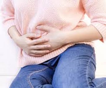 woman holding her stomach