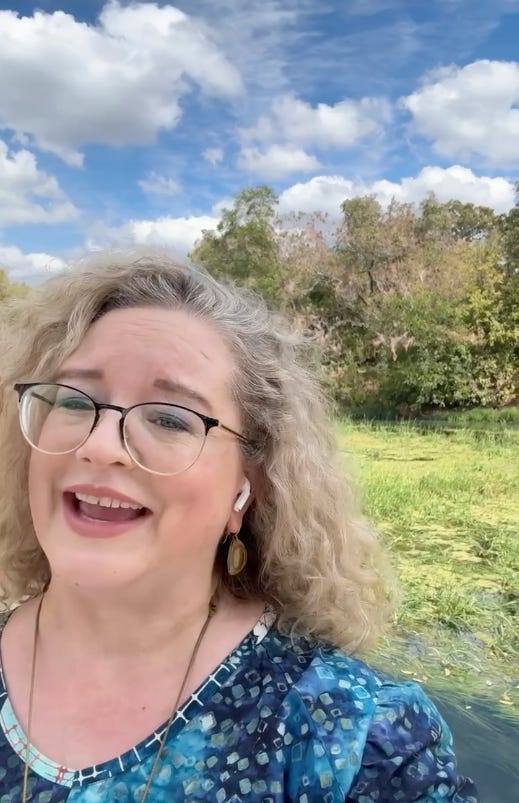 Gwendolyn Hustvedt standing by San Marcos River smiling outdoors in natural setting