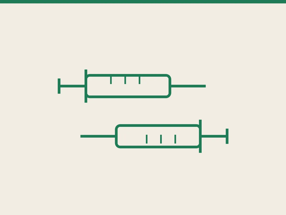Two syringes pointing in opposite directions