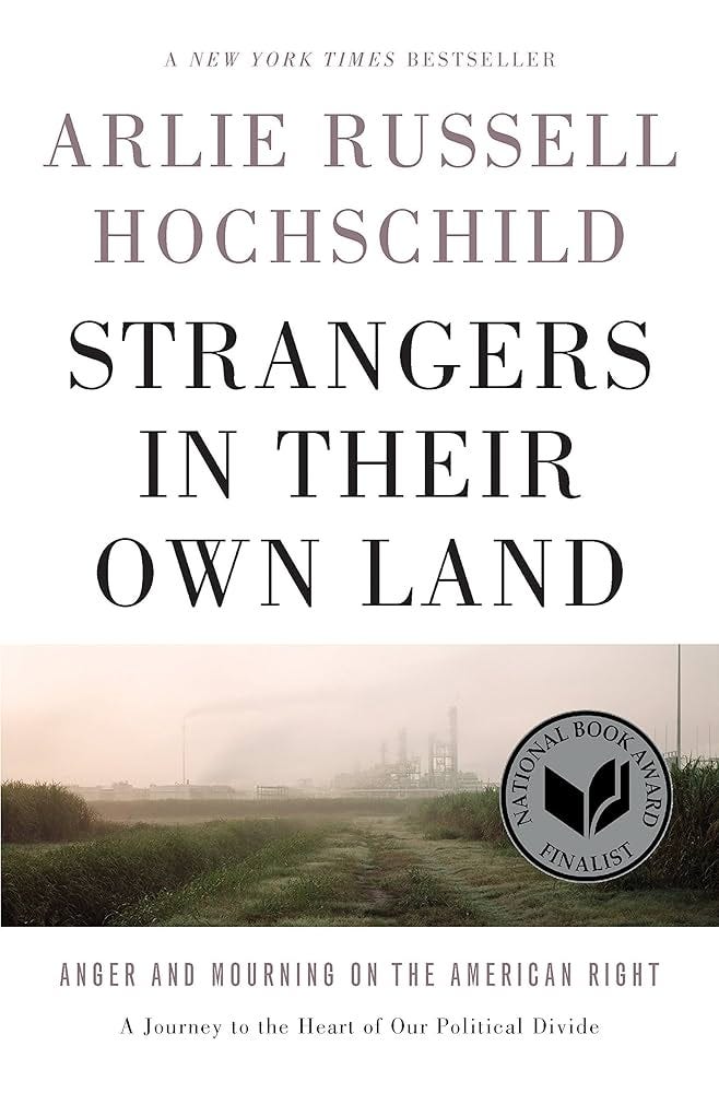 Cover of Strangers in Their Own Land by Arlie Russel Hochschild. White cover with banner image of a polluted landscape with a factory / smokestacks. Title and author name at the top in black.