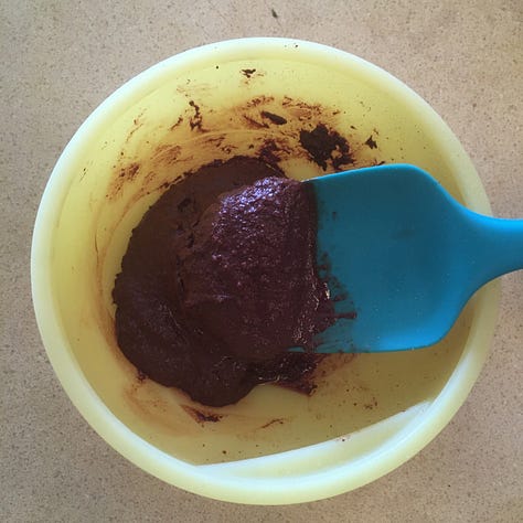 Fudge chocolate on a fork and molded chocolate squares and stars