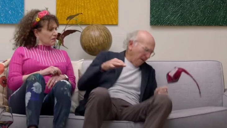 Susie Essman plopping on couch