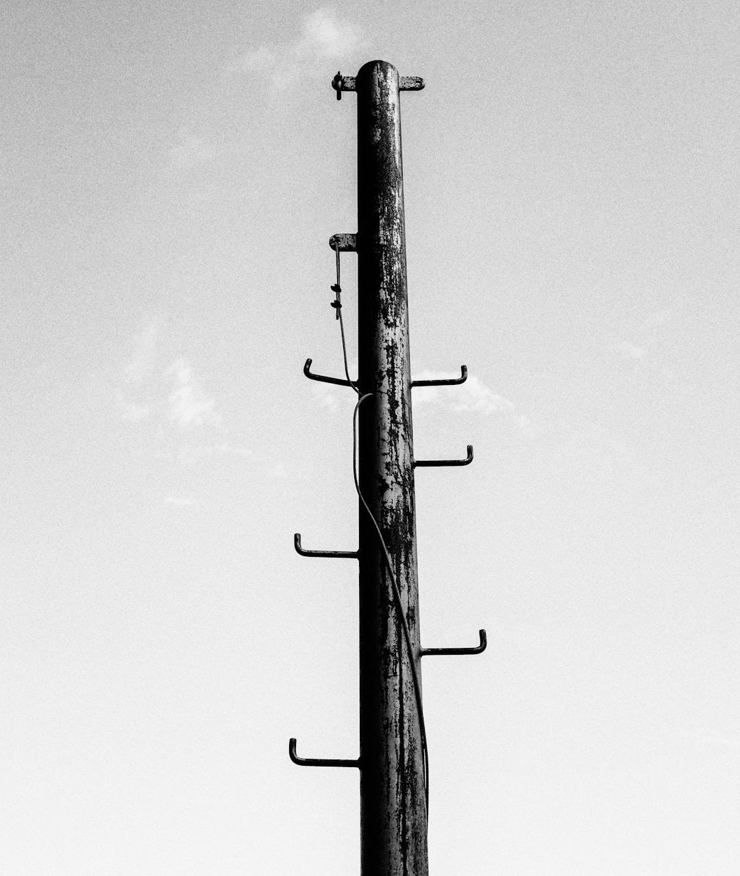 grayscale photo of utility pole