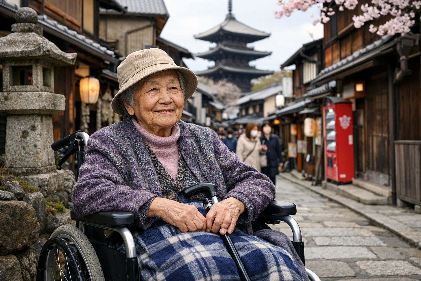 This is a warm and dignified portrait of an elderly Japanese woman in a wheelchair, photographed on a traditional street in Japan. Here's a detailed description: Subject:  An elderly woman with a gentle, content smile wearing a beige bucket hat Dressed in a purple/mauve knitted cardigan over a pink turtleneck sweater A blue and white plaid blanket covers her lap Seated in a black wheelchair with her hands resting on the armrests  Setting:  A picturesque traditional Japanese street, likely in Kyoto (possibly the Higashiyama district or near Yasaka Pagoda) A five-tiered pagoda (gojū-no-tō) is prominently visible in the background Traditional wooden machiya buildings line both sides of the sloped street Cherry blossom branches frame the top right corner of the image Stone lanterns and traditional architectural details visible Paper lanterns and red vending machines add pops of color Other pedestrians visible in the mid-ground, some wearing masks