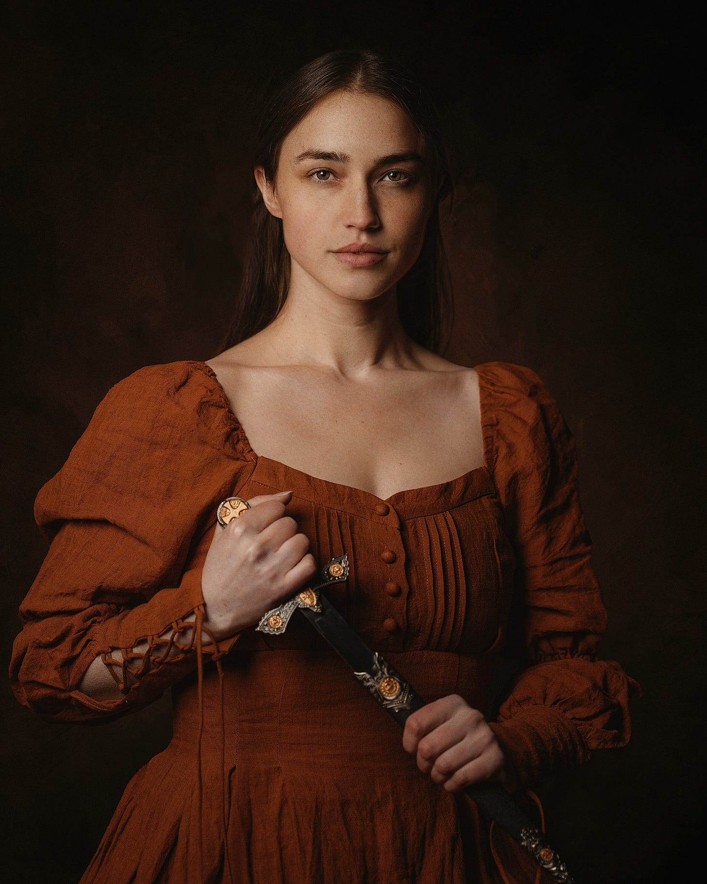 Photo of Judith holding a sword