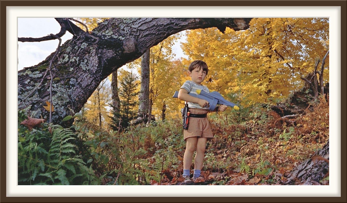 Jerry Mathers as Arnie with a toy ray gun in autumn woods