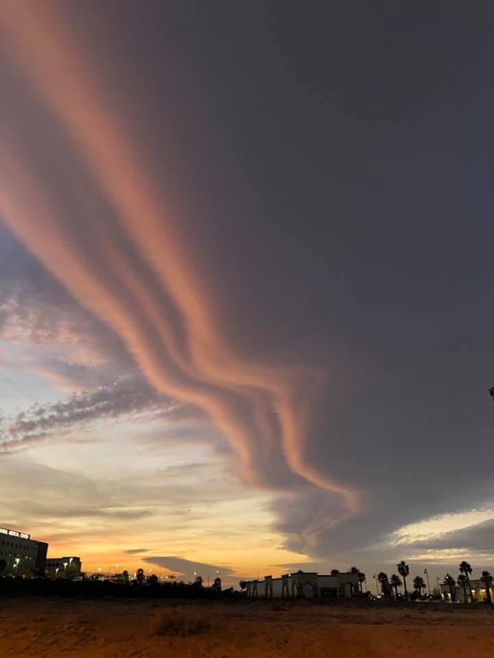 Photo of spectacular lenticular cloud formation at sunset.