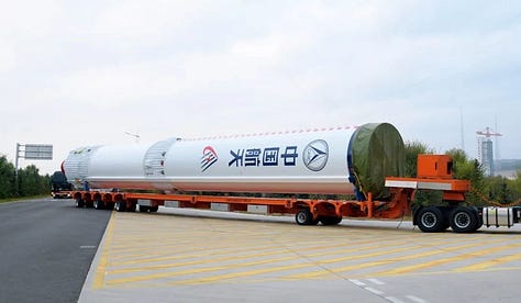 The Long March 6A's first-stage, second-stage, and fairing being brought to Launch Complex 9A ahead of its July 4th 2026 mission.