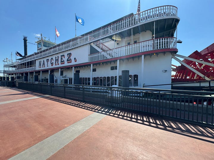 Scenes from New Orleans: Altar in St. Louis Cathedral; Kelvin the oyster shucker behind the bar at Crescent City Brewhouse; beignets at Cafe Du Monde; the Natchez sternwheeler at dock.