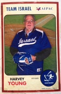 Batting 3rd, and playing pitcher's helper, Harvey Young.