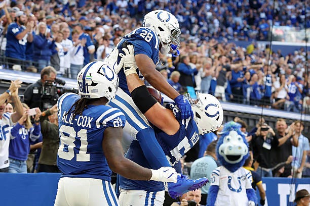 Jonathan Taylor of the Indianapolis Colts celebrates a touchdown against the Arizona Cardinals during the fourth quarter in the game at Lucas Oil...