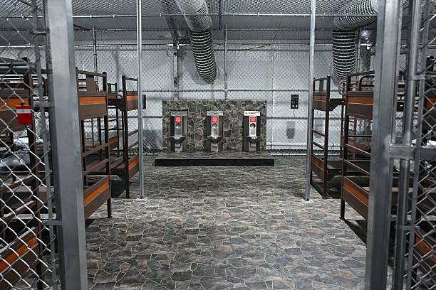 Toilets and beds are seen inside a migrant detention center, dubbed "Alligator Alcatraz," located at the site of the Dade-Collier Training and...