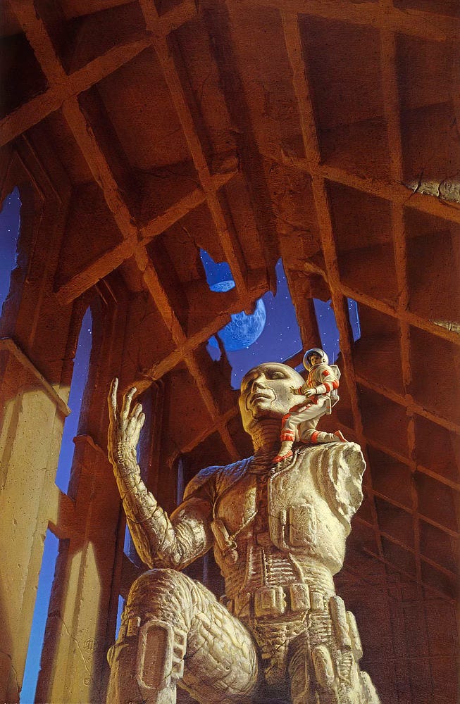 In a cavernous room, a man in a spacesuit kneels on the shoulder of a huge ancient statue of a humanoid robot. The statue is missing an arm. The vaulted ceiling above is similarly weathered, open to expose the night sky and a craggy moon.