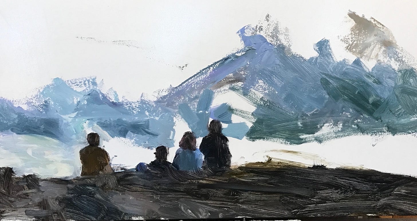 A group of people sitting on a rock

Description automatically generated