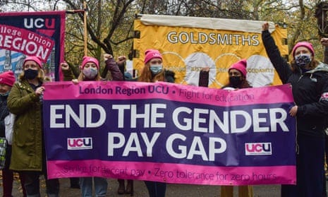 Demonstrators hold an End the Gender Pay Gap banner during a University and College Union strike and protest in London in 2021. Demonstrators hold an End the Gender Pay Gap banner during a University and College Union strike and protest in London in 2021.