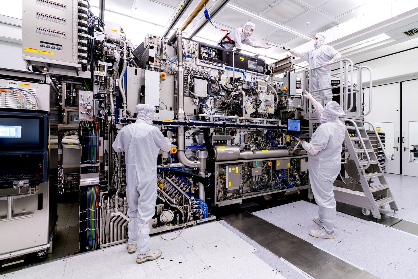 Employees assembling EUV system