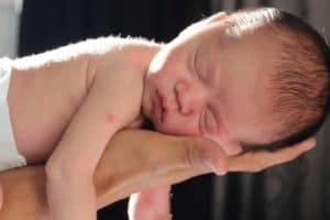 Small baby in a person's hands