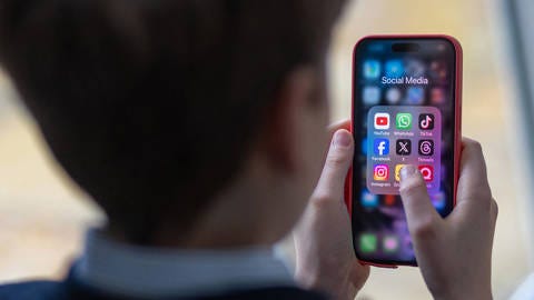 Child using social media on phone. Child using social media on phone.