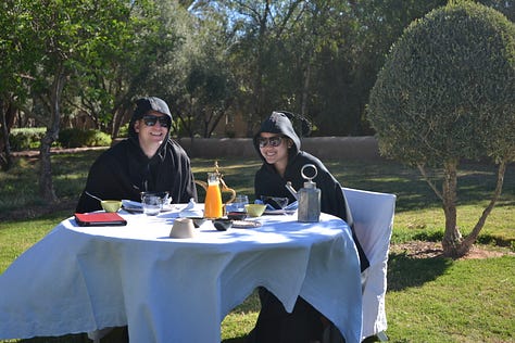 Moments from Dar Ahlam showing the thoughtful hospitality experience - the kasbah grounds, intimate dining spaces, desert excursions, and candlelit dinners that exemplified genuine welcome.