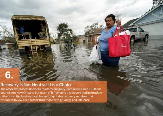 A person carrying a bag in a flooded street

AI-generated content may be incorrect.