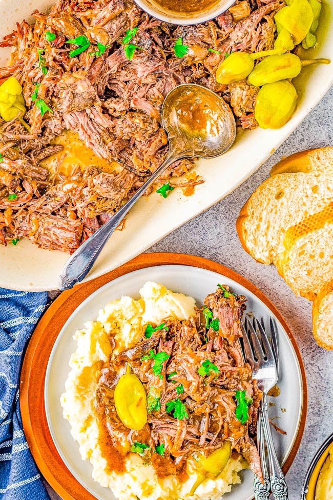 A plate of Mississippi pot roast over mashed potatoes. 