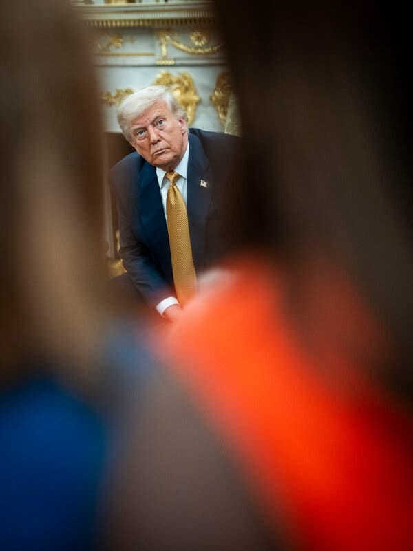 President Trump, in a blue blazer and gold tie. President Trump, in a blue blazer and gold tie.