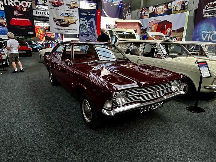 4 photos of cars at The Great British Car Journey A: 1972 Ford Escort B: 1972 Mk3 Ford Cortina C: 1973 Gilbern Invader - a car made in Wales and this is one of the last as the company went bankrupt in 1973 D: 1988 Ford Capri Images: Roland's Travels 2023