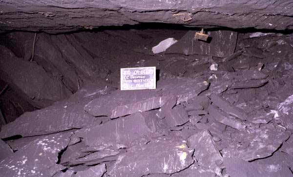 Four photographs showing Mine No. 5, a roof fall, damaged mining equipment, and an underground entry destroyed by the explosion.