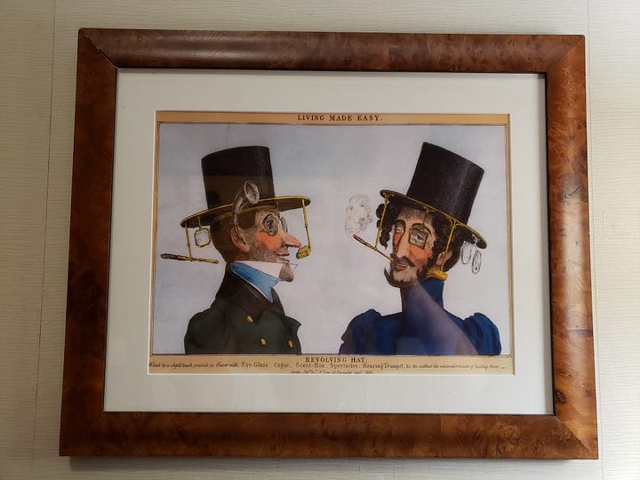 Reference to the Tress & Co. hat factory is part of the room decor.