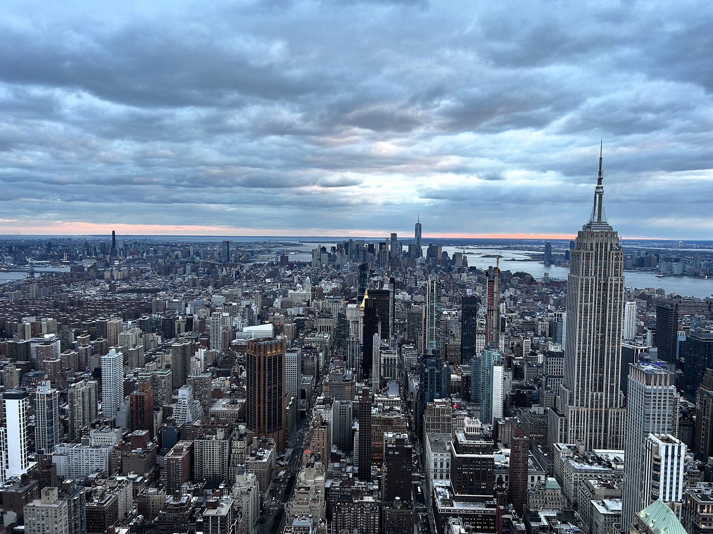 View of Manhattan from top of the Summit, looking downtown towards Empire State Building in foreground and One World Trade Center in distance View of Manhattan from top of the Summit, looking downtown towards Empire State Building in foreground and One World Trade Center in distance