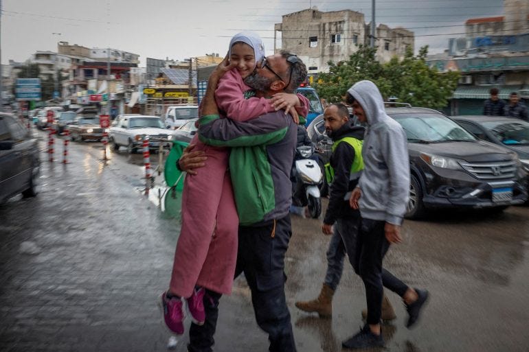 Mohammed Sleem hugs his daughter Menisa Sleem, as he meets her after two months, according to Mohammed, after a ceasefire between Israel and Iran-backed group Hezbollah