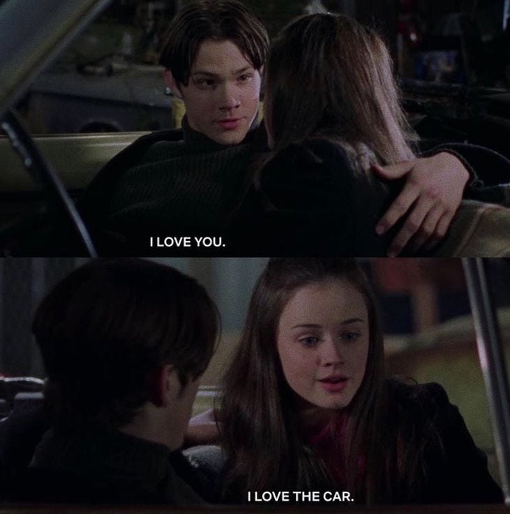 This may contain: two people sitting in a car with the caption'i love you, i love the car '