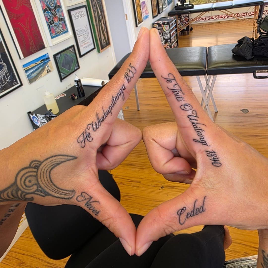 May be an image of one or more people, henna and text