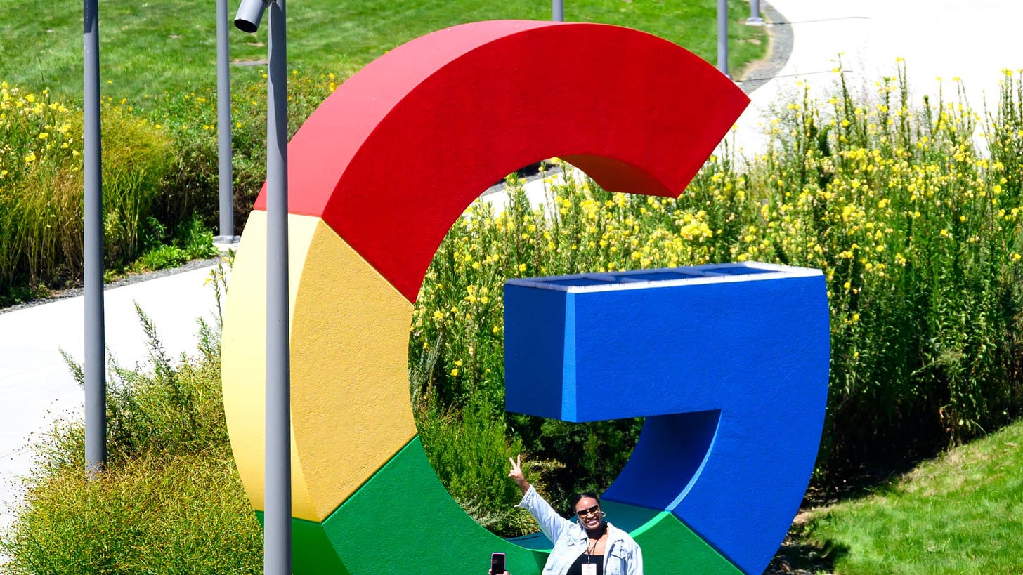 People take photos in front of a giant Google logo at Google's Bay View campus in Mountain View, California on Aug 13, 2024 where the "Made by Google" media event was held today. 