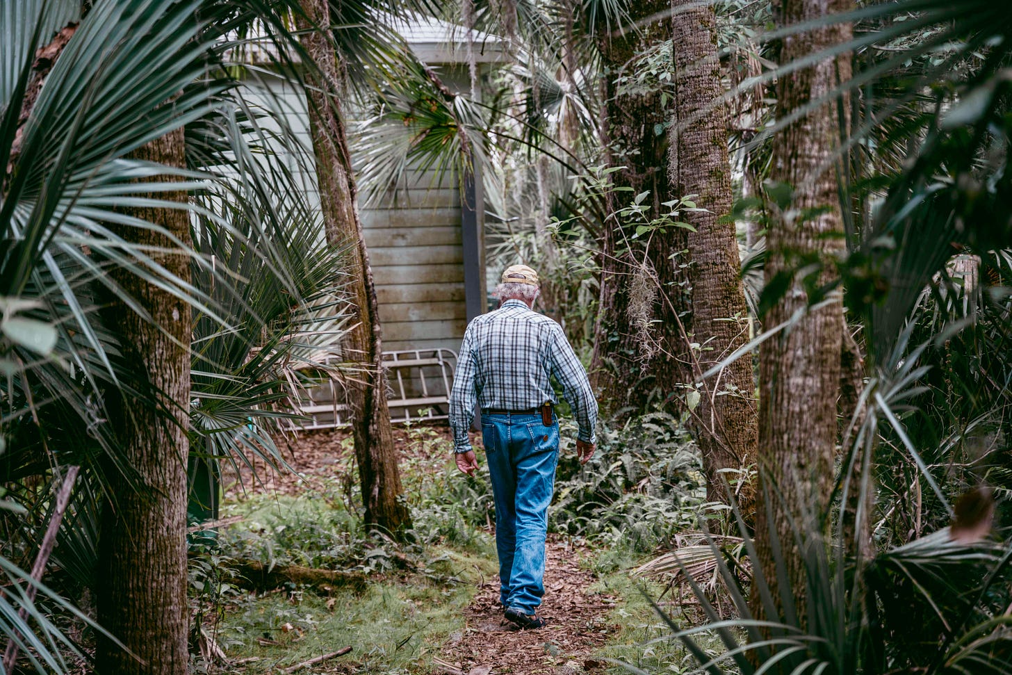 Flip wandering back to his south Florida house in jeans.