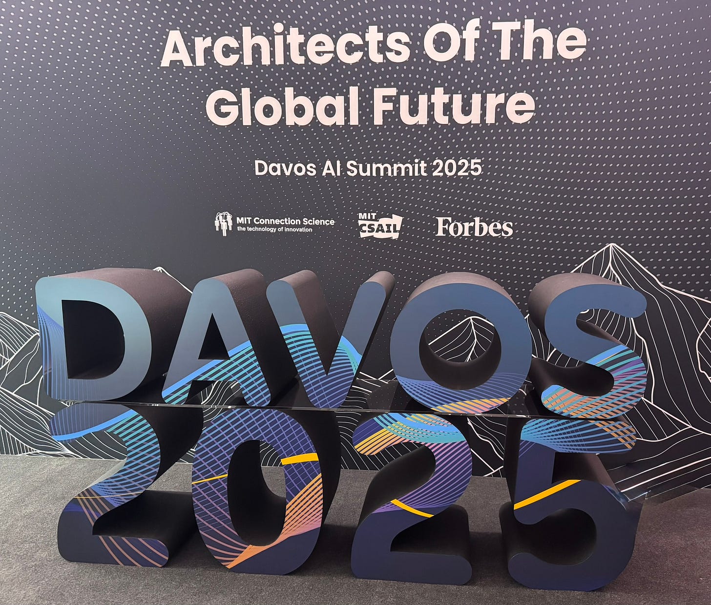 Signage saying "Architects of a Global Future: Davos 2025"