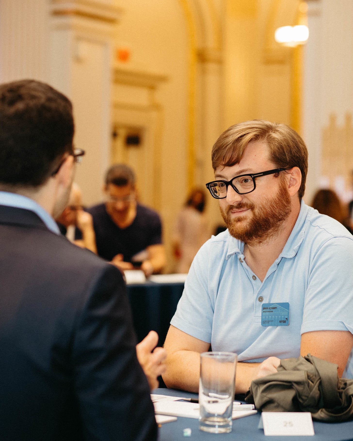 CEO and co-founder of Anduril Brian Schimpf (R) exchanges notes with Scott Bade, senior analyst of geotechnology at Eurasia Group CEO and co-founder of Anduril Brian Schimpf (R) exchanges notes with Scott Bade, senior analyst of geotechnology at Eurasia Group